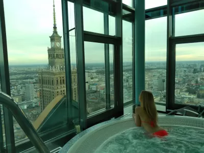 How To Sarudza A Swimsuit For Winter? Ski, jacuzzi, pool : Beautiful young woman wearing a plain orange bhikini in the jacuzzi in winter in Warsaw Intercontinental high rise spa